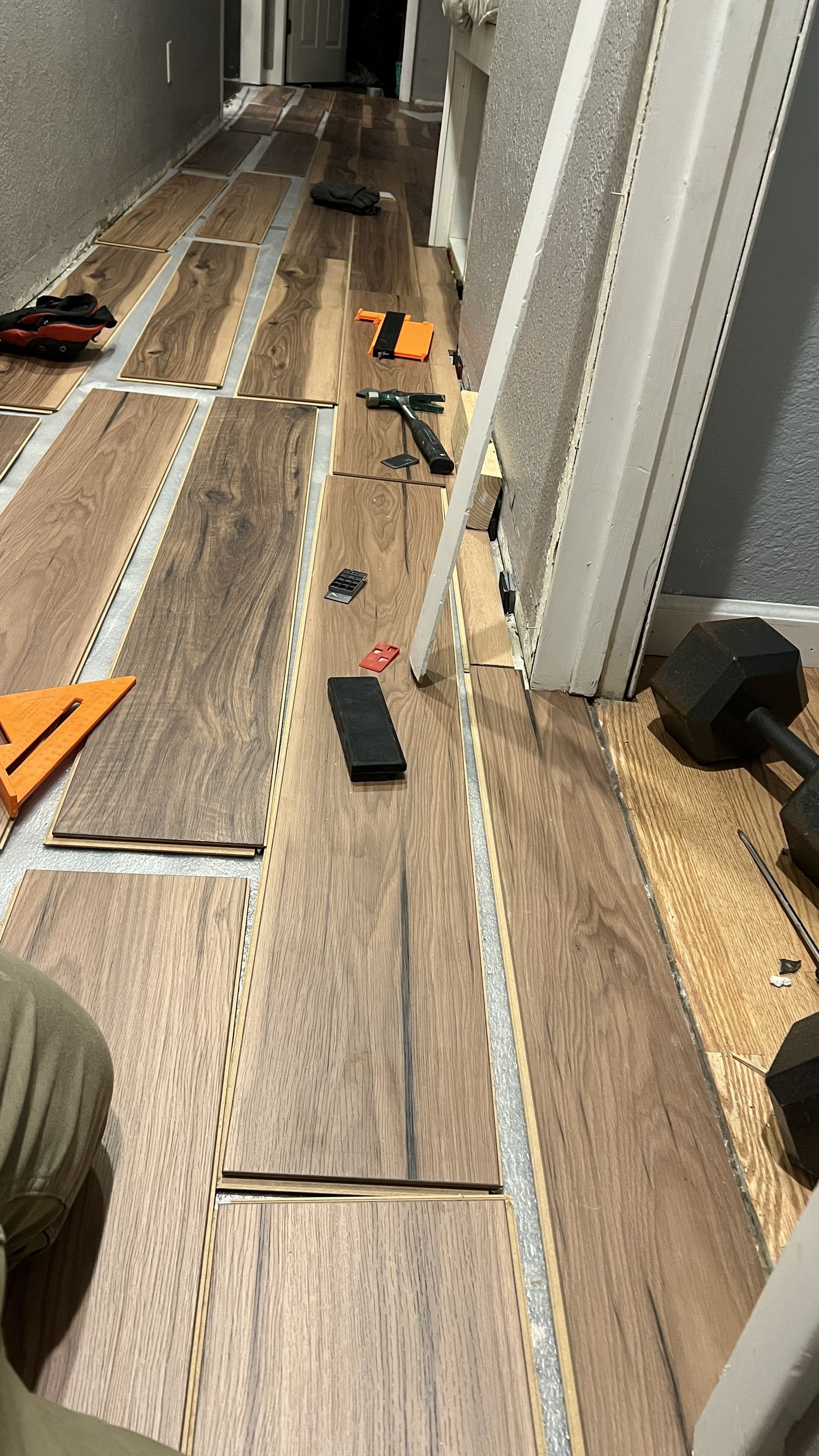Plank flooring going down at Craigs House, board by board, by our own crew.